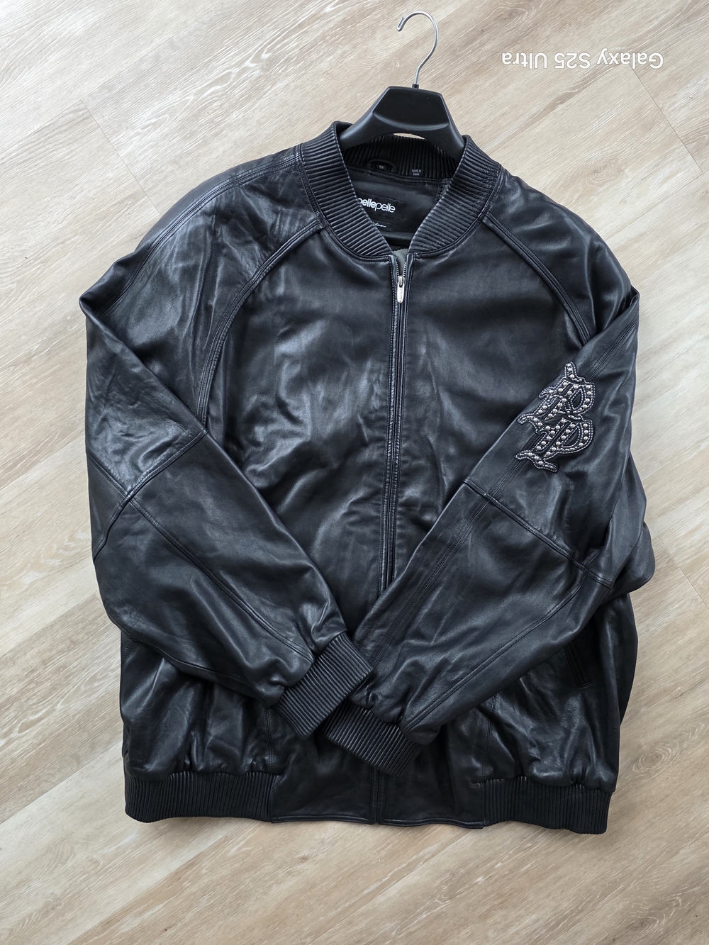 Pelle Pelle Black Leather Bomber Jacket with Embroidered Sleeve Patch